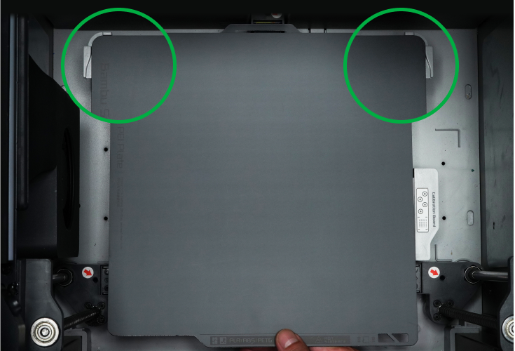 Step 1: Align the plate with the fixed points of the platform with the name of the plate facing you
